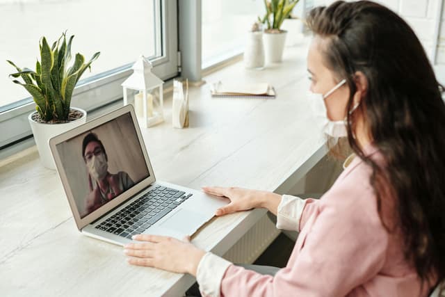 Mother and child using telehealth app